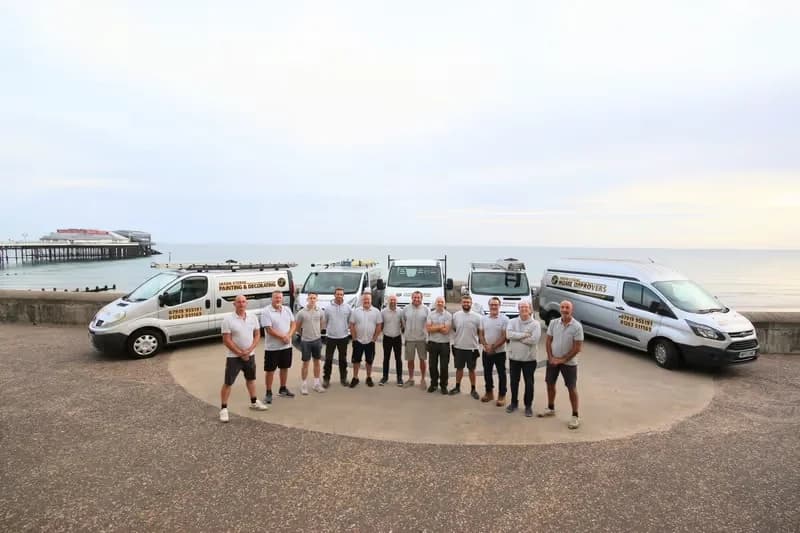 The Jason Sterne team with their branded vans on Cromer promenade