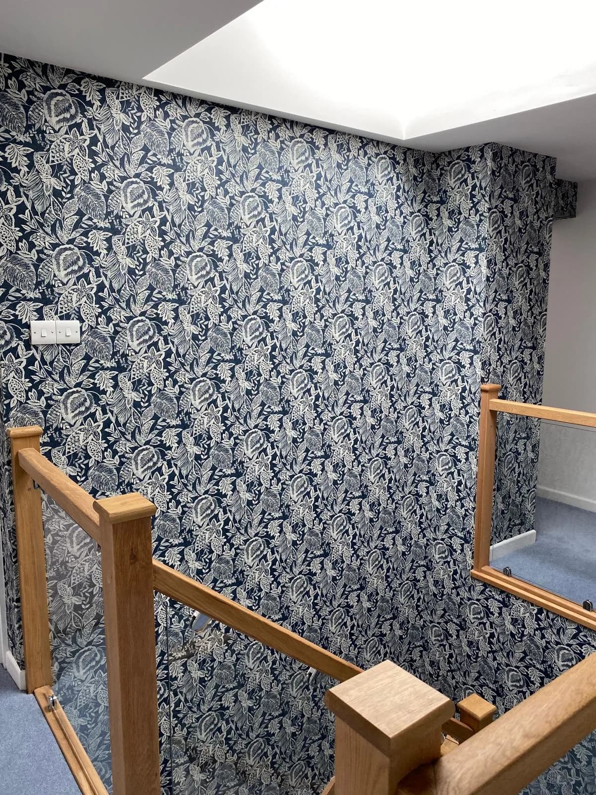 Navy floral feature wall on a landing
